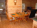 Dining room table opens up to seat 8-10 people.