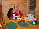 Sheryl eating the first dinner at the new dining room set.  It's Taco Bell, of course!