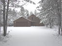 View of the 2 car attached garage and South side of home