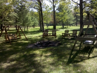 Campfire firepit area of Wilderness Pines vacation home.