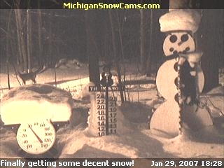 Picture of Snowman with deer in background. Sent in by Randy Bailey.